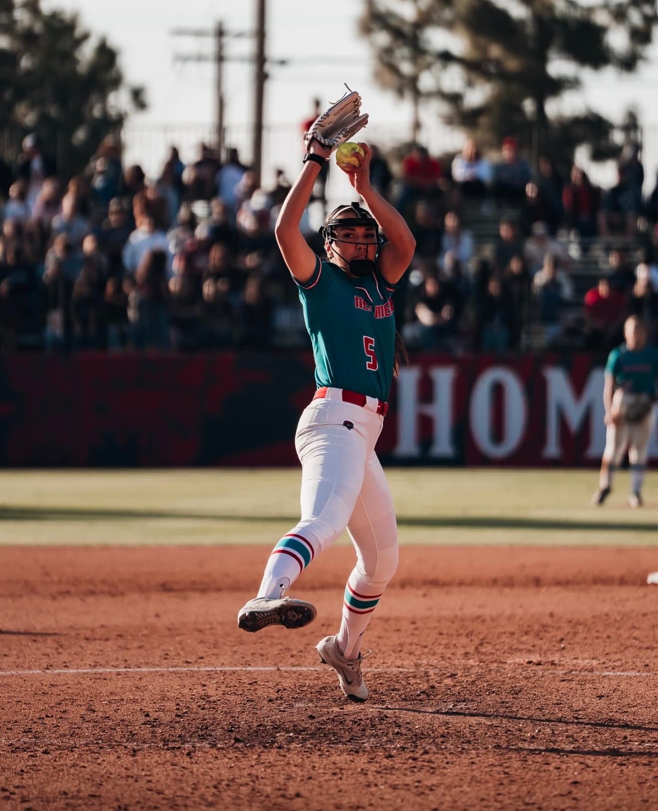 Lexi Atcitty coaching pitching